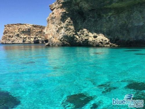Blue waters during a stop at Comino trip